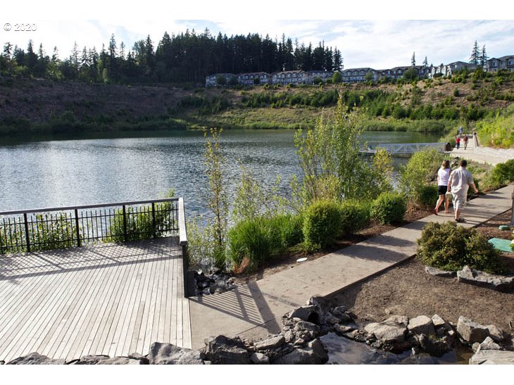 14805 Southwest Sandhill Loop, Unit 203 Beaverton, OR 97007 - Photo 20 of 20 a view of a patio in front of lake and mountain view