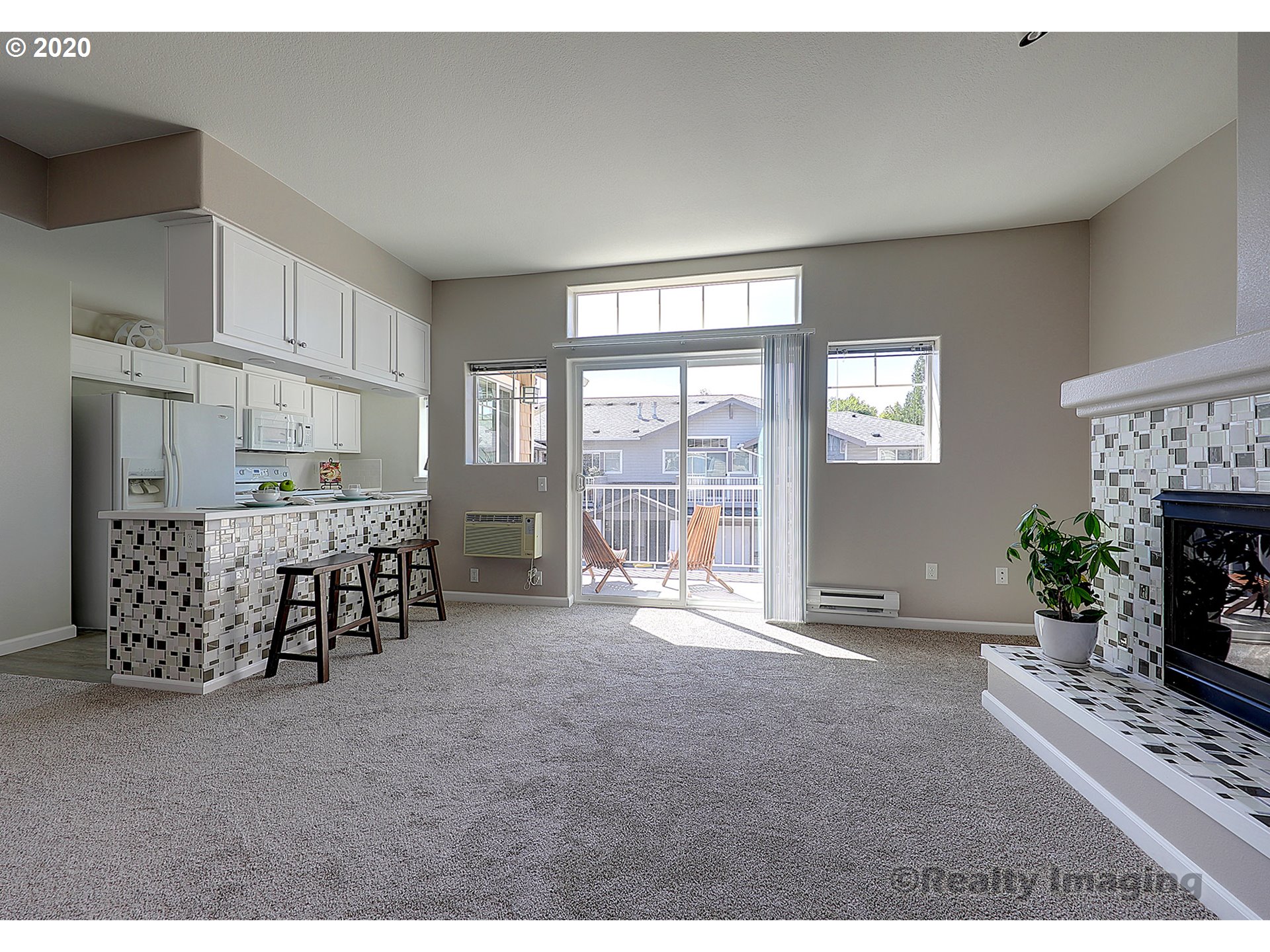14805 Southwest Sandhill Loop, Unit 203 Beaverton, OR 97007 - Photo 2 of 20 a living room with furniture and a fireplace