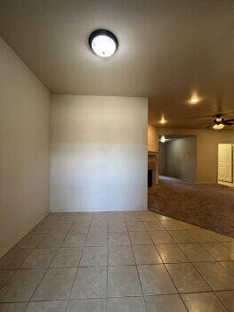3205 112th Street Lubbock, TX 79423 - Photo 3 of 19 an empty room with a natural light