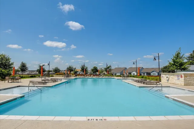 a view of a terrace with outdoor seating and city view