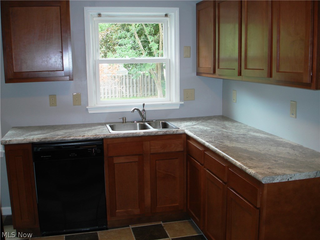 4803 Farnhurst Road Cleveland, OH 44124 - Photo 8 of 28 Newer cabinets, counter, ceramic tile floor, updated!