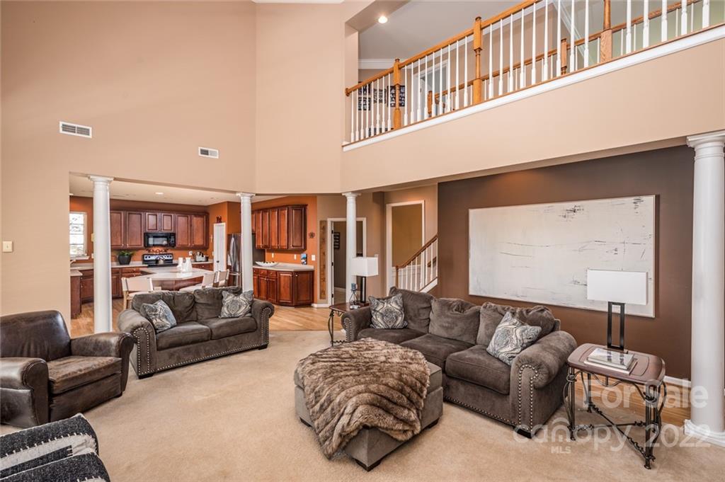 3421 Rolin Avenue Fort Mill, SC 29708 - Photo 9 of 38 a living room with furniture ceiling fan and a rug