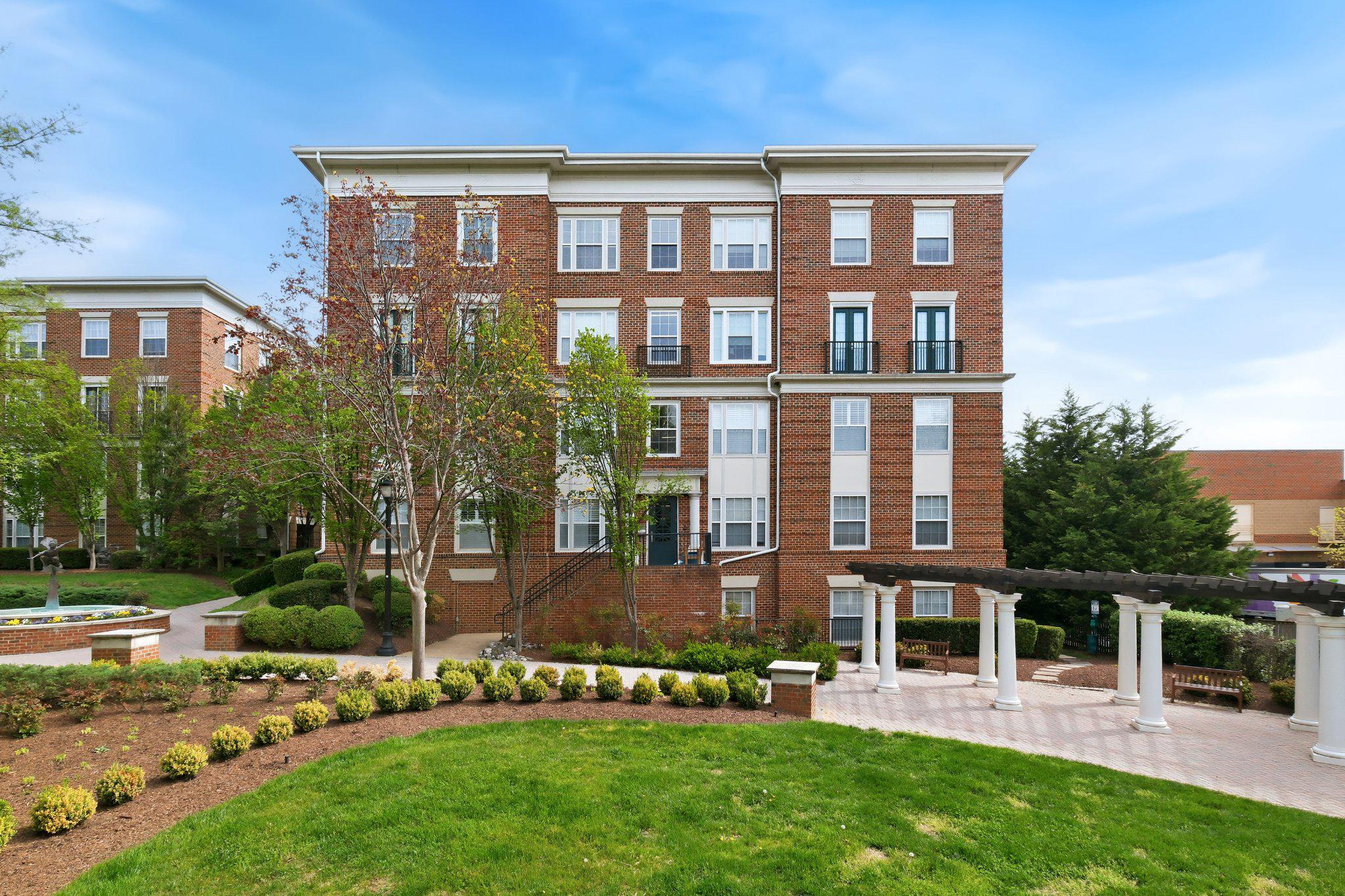 a view of a brick building with a yard