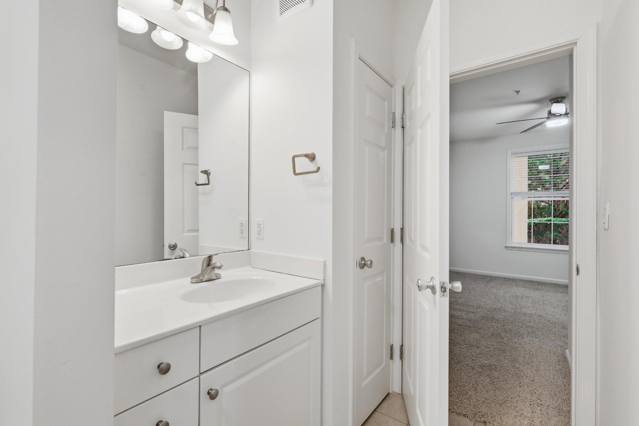 31 Booth Street, Unit B55 Gaithersburg, MD 20878 - Photo 16 of 30 a bathroom with a sink a mirror and a shower