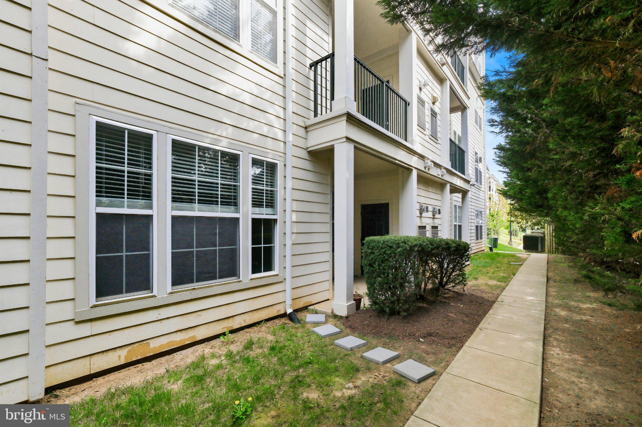 31 Booth Street, Unit B55 Gaithersburg, MD 20878 - Photo 20 of 30 a view of a house with a yard