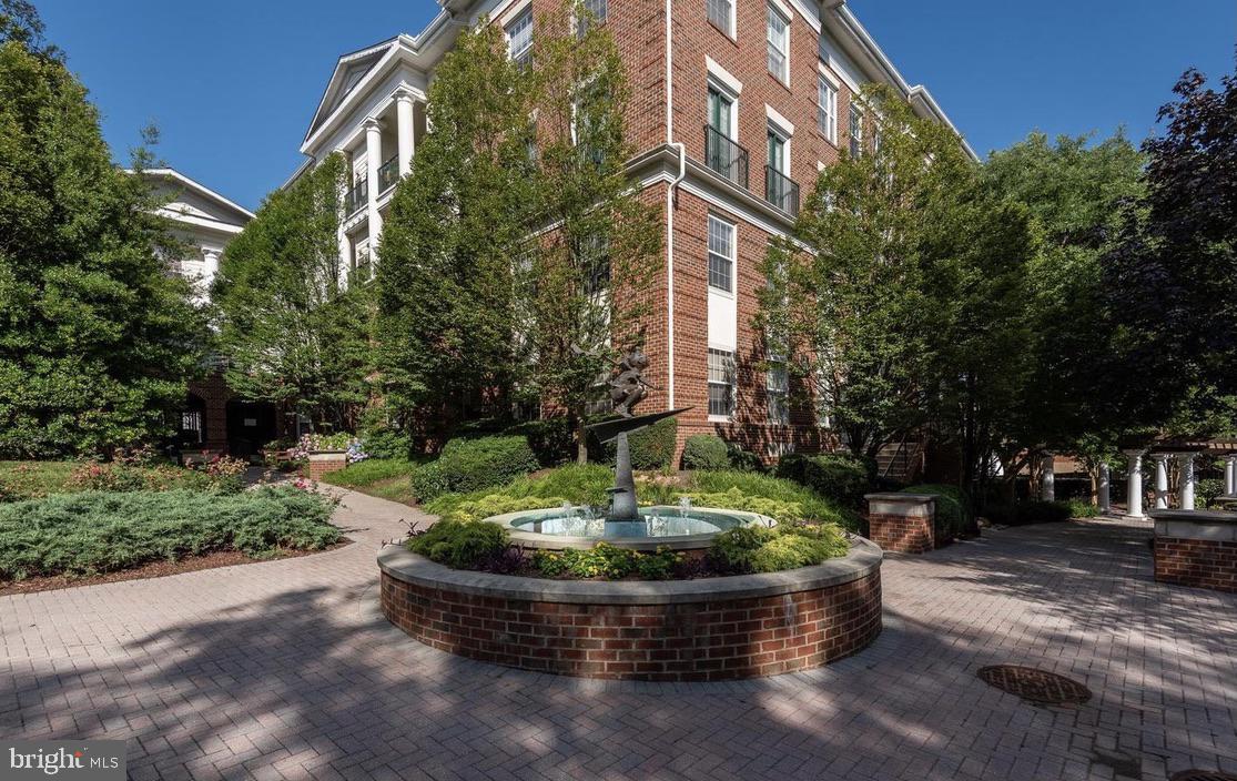 31 Booth Street, Unit B55 Gaithersburg, MD 20878 - Photo 2 of 30 a front view of a house with a yard