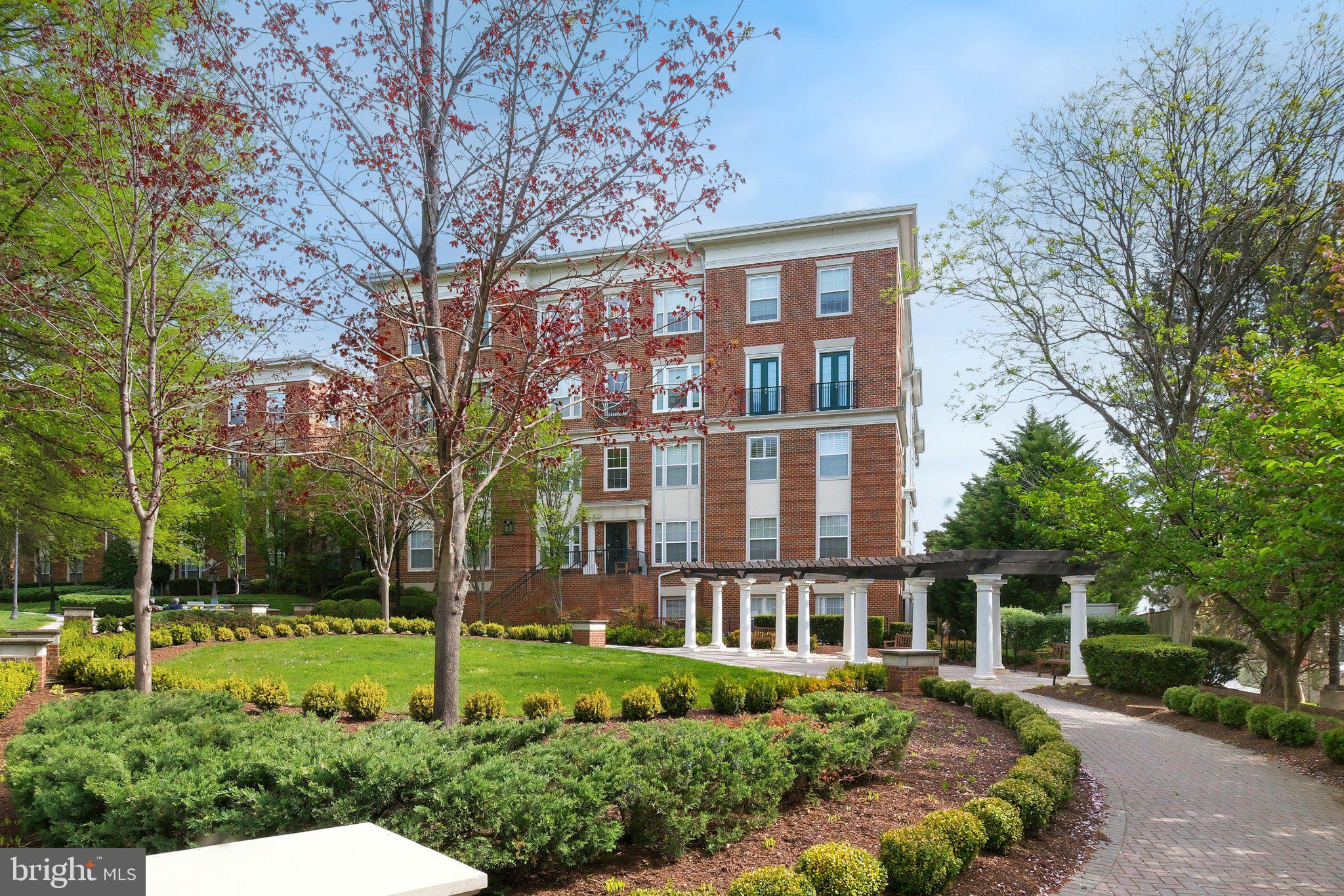 31 Booth Street, Unit B55 Gaithersburg, MD 20878 - Photo 21 of 30 a front view of a house with a yard