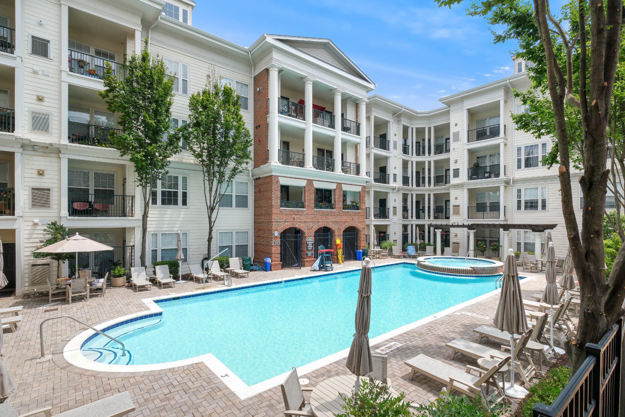 31 Booth Street, Unit B55 Gaithersburg, MD 20878 - Photo 24 of 30 a view of a building with a swimming pool