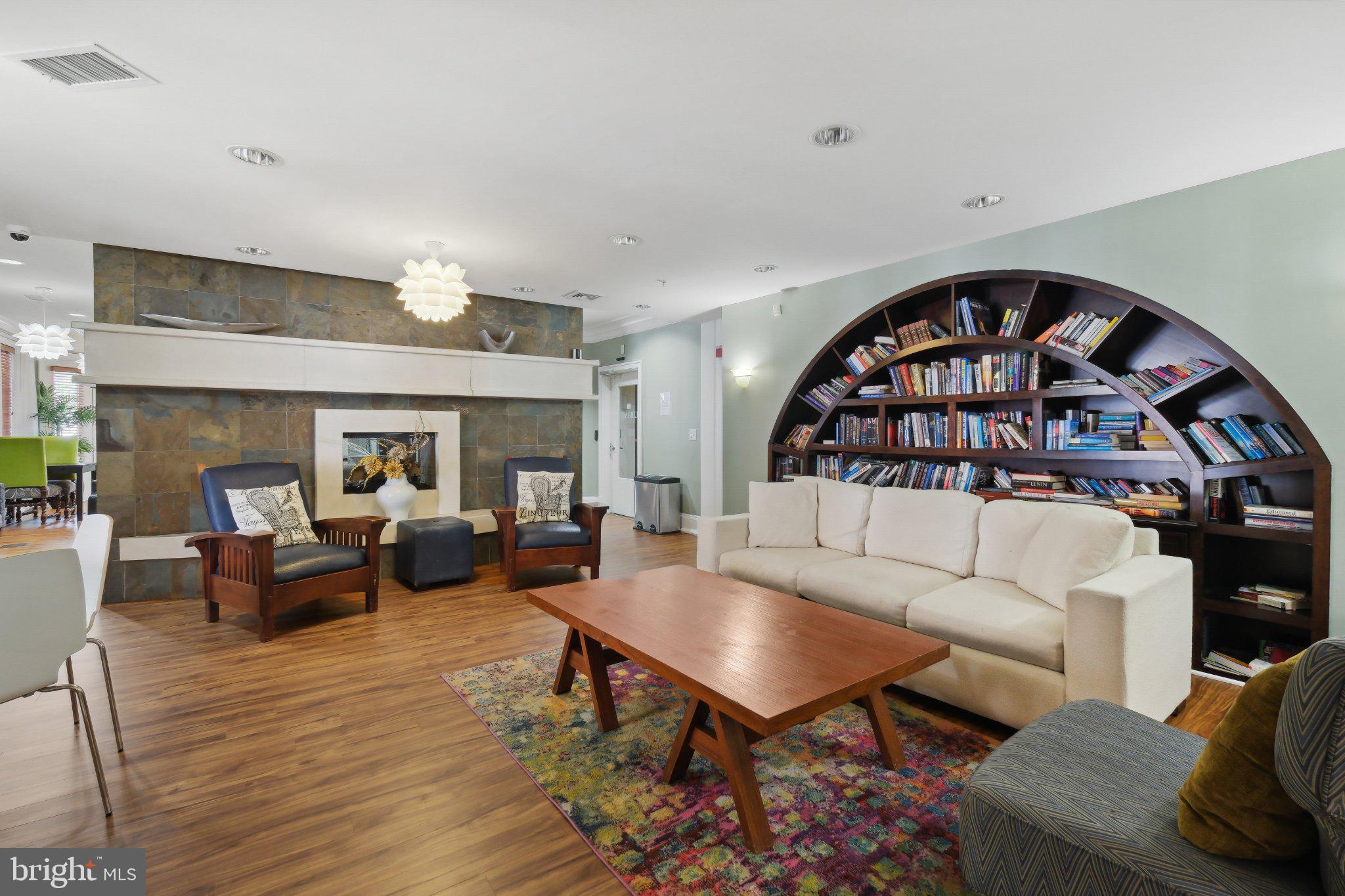 31 Booth Street, Unit B55 Gaithersburg, MD 20878 - Photo 29 of 30 a living room with furniture and a wooden floor