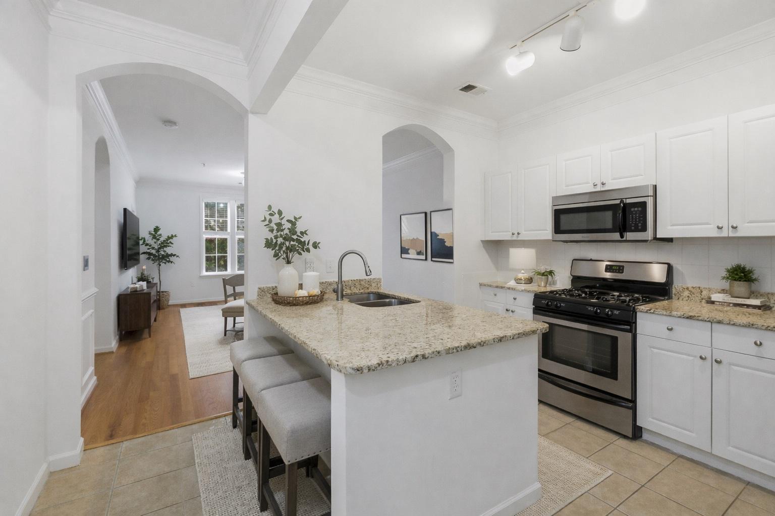 31 Booth Street, Unit B55 Gaithersburg, MD 20878 - Photo 3 of 30 a kitchen with sink a microwave and cabinets