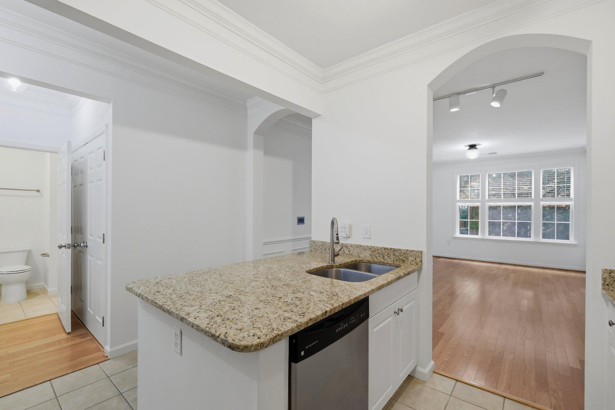 31 Booth Street, Unit B55 Gaithersburg, MD 20878 - Photo 6 of 30 a kitchen with a sink stove and refrigerator