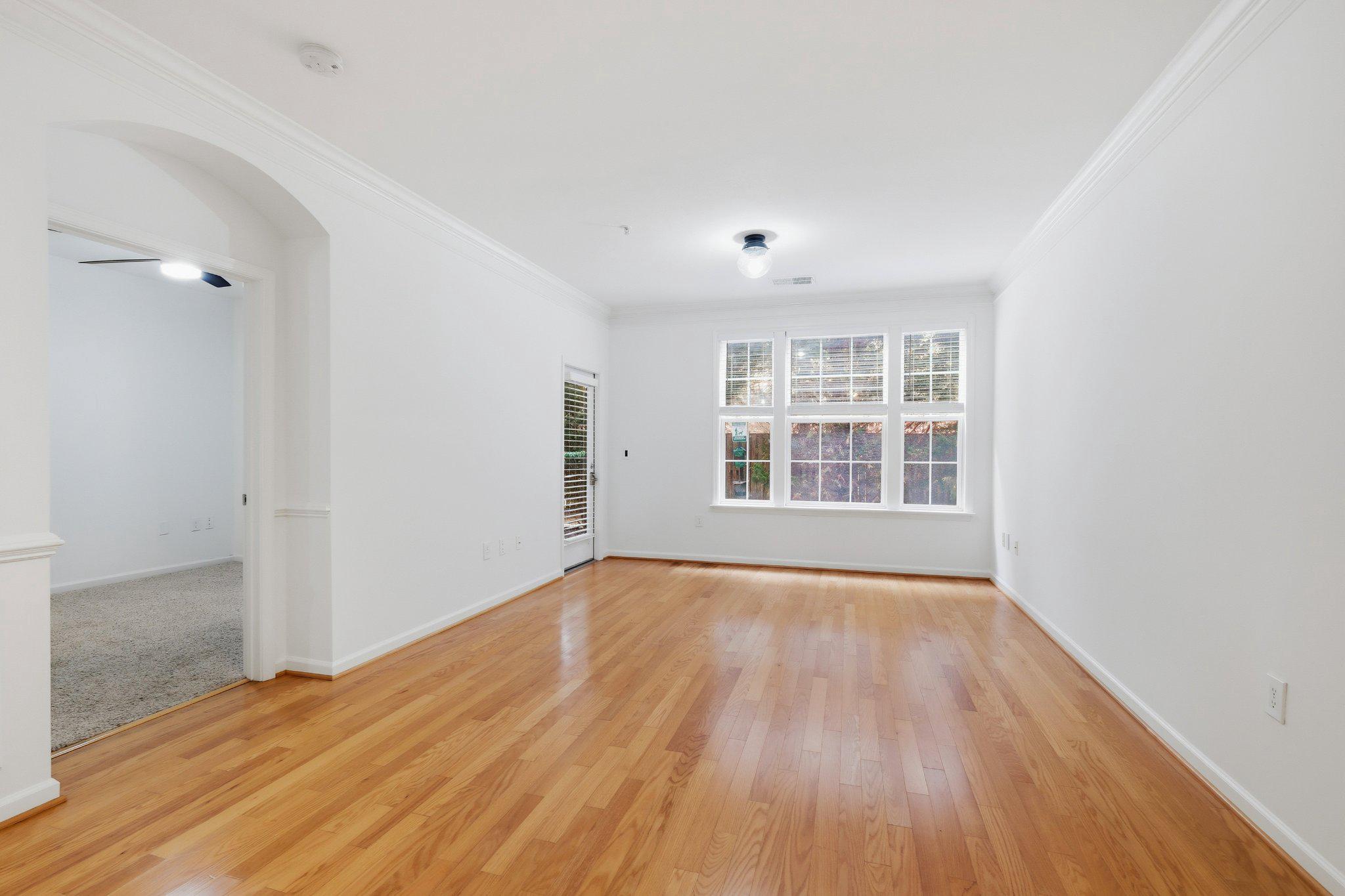 31 Booth Street, Unit B55 Gaithersburg, MD 20878 - Photo 9 of 30 an empty room with wooden floor and windows