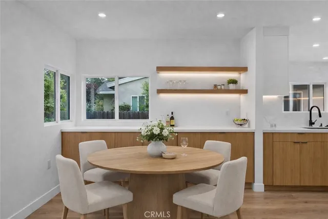 a dining room with furniture and window