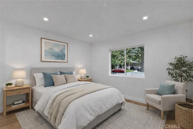 a bedroom with a bed and a couch