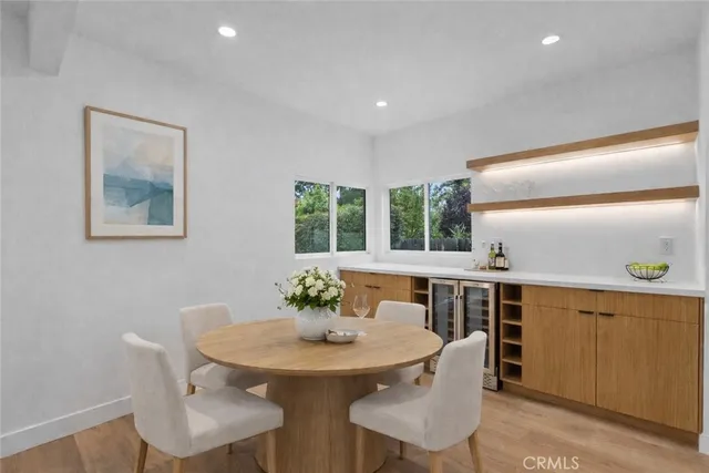 a view of a dining room with furniture and window