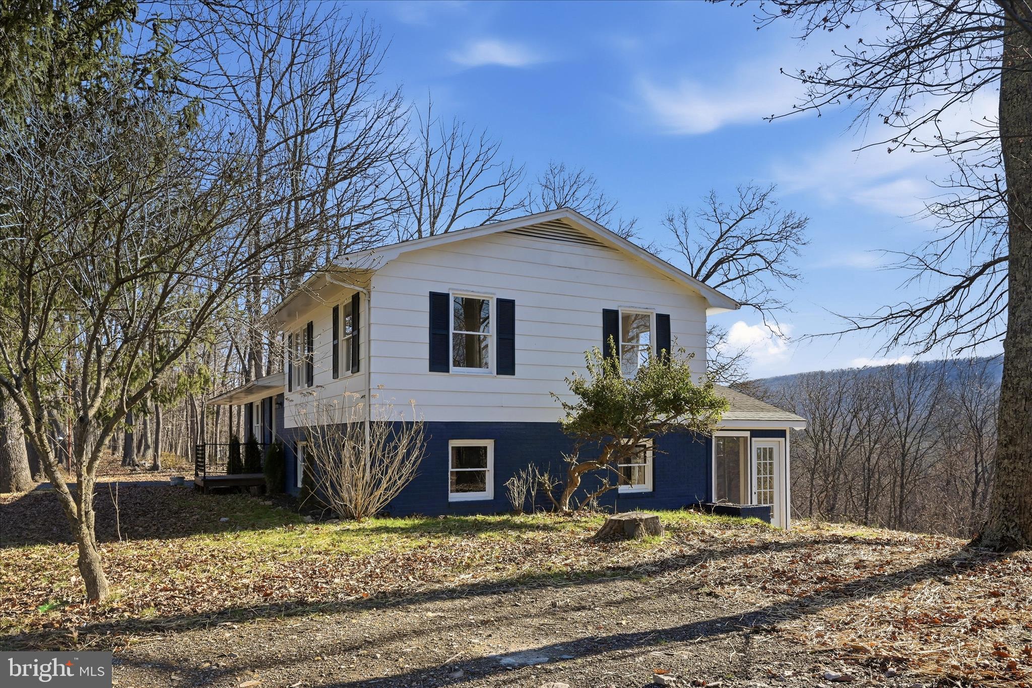 2280 Pine Grove Road Berkeley Springs, WV 25411 - Photo 44 of 59 a front view of a house with garden