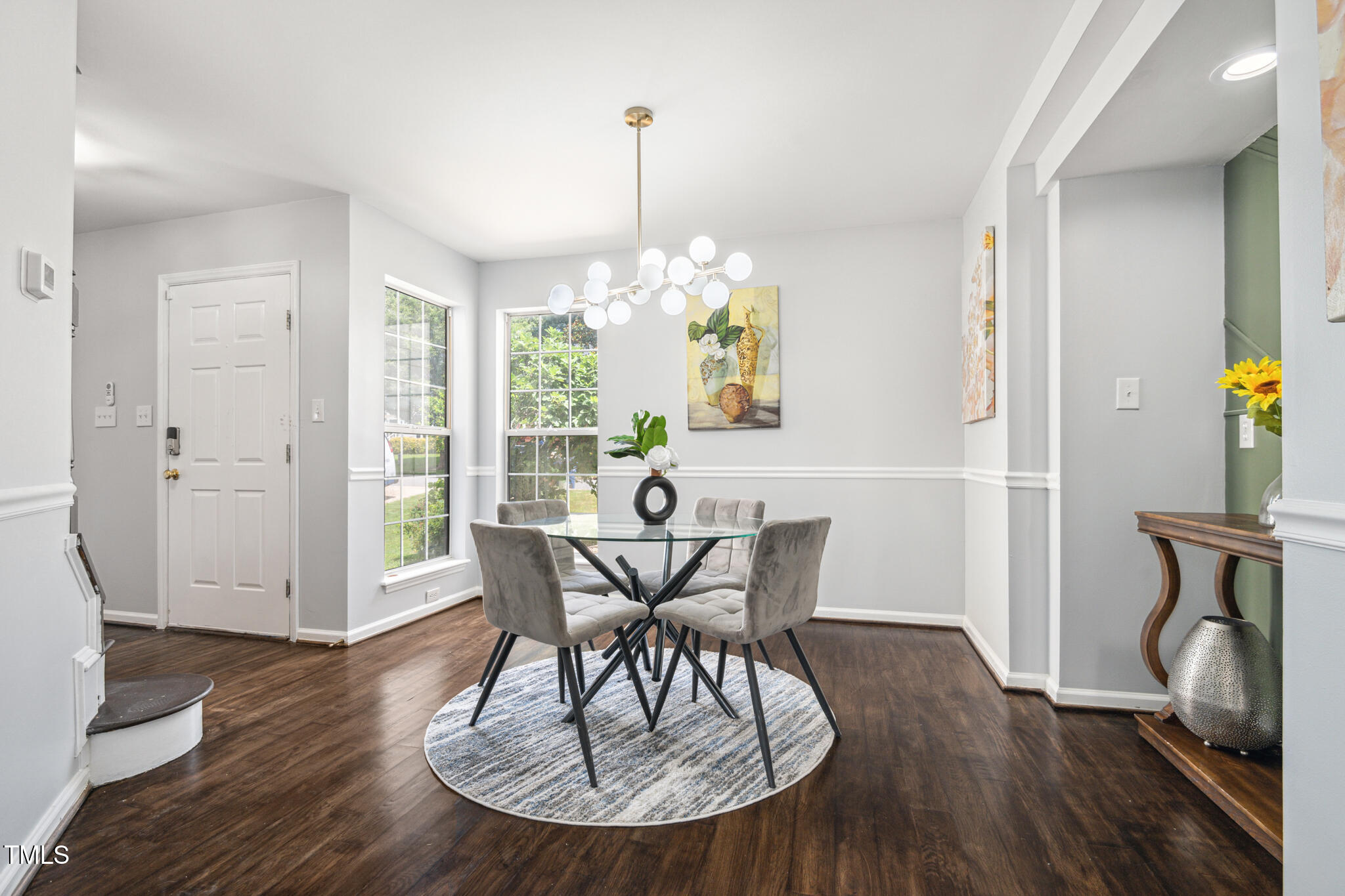 2516 Constitution Drive Raleigh, NC 27615 - Photo 8 of 38 a view of a dining room with furniture window and wooden floor