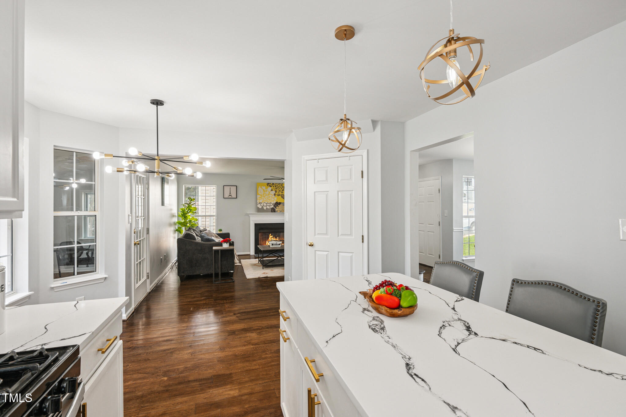 2516 Constitution Drive Raleigh, NC 27615 - Photo 10 of 38 a view of a livingroom with furniture wooden floor and a chandelier
