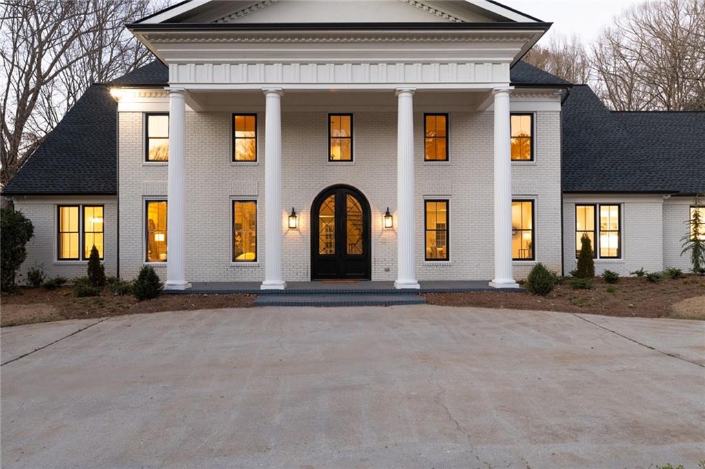 1141 Regency Road Northwest Atlanta, GA 30327 - Photo 1 of 1 a front view of a house