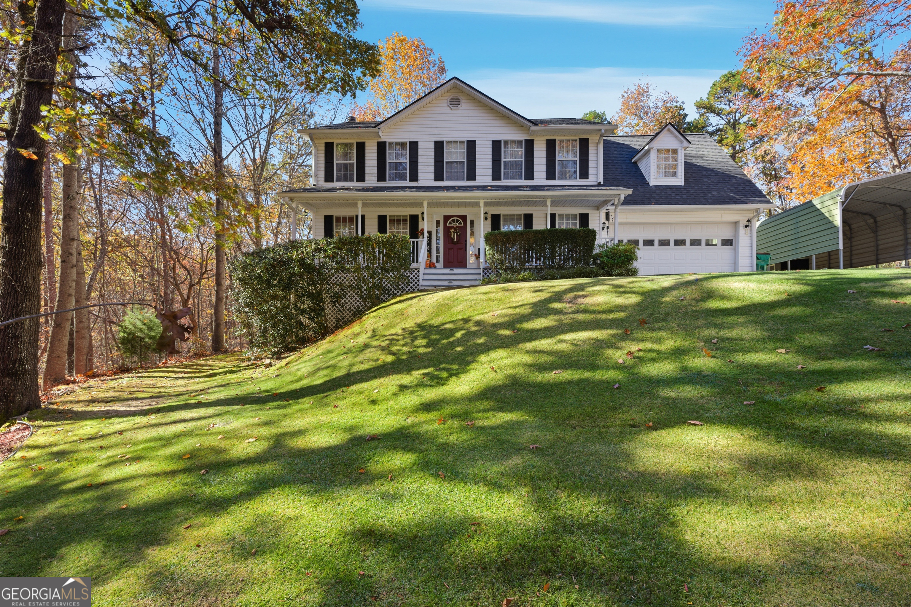 a front view of house with yard and green space