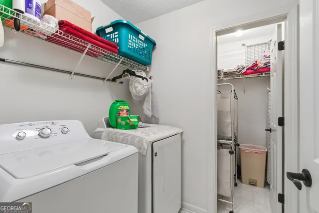 a bed room with a bed and a chandelier