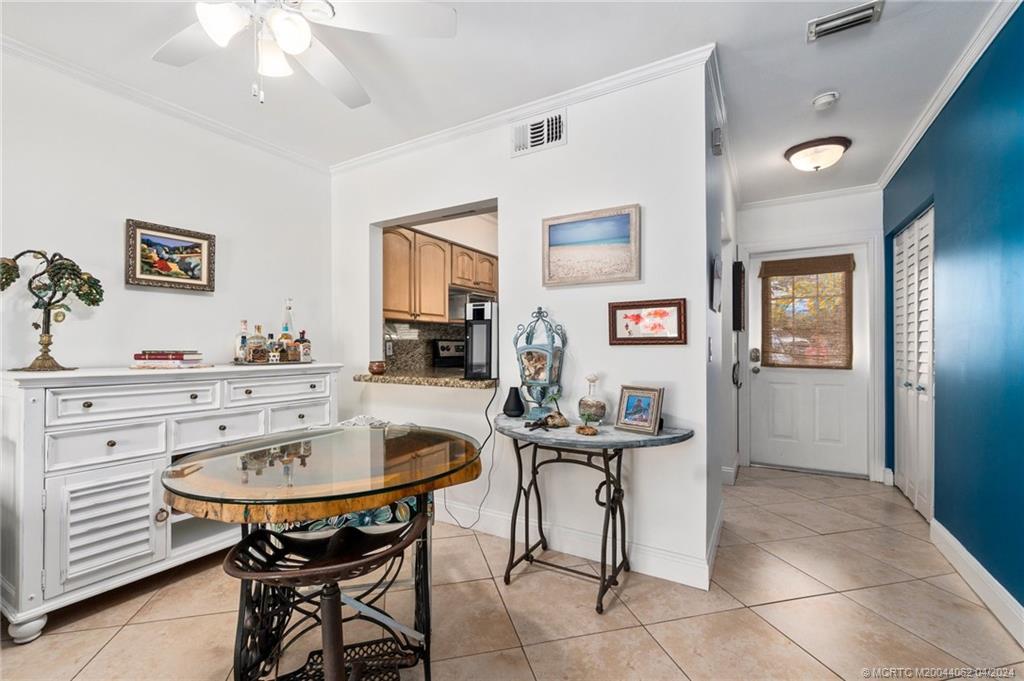 3135 Southeast Indian Street, Unit 5 Stuart, FL 34997 - Photo 12 of 41 a view of a dining room with furniture