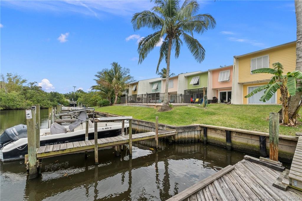 3135 Southeast Indian Street, Unit 5 Stuart, FL 34997 - Photo 2 of 41 a view of a house with pool porch and wooden floor