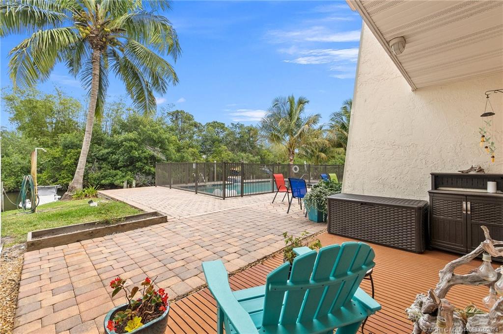 3135 Southeast Indian Street, Unit 5 Stuart, FL 34997 - Photo 29 of 41 a view of a backyard with plants