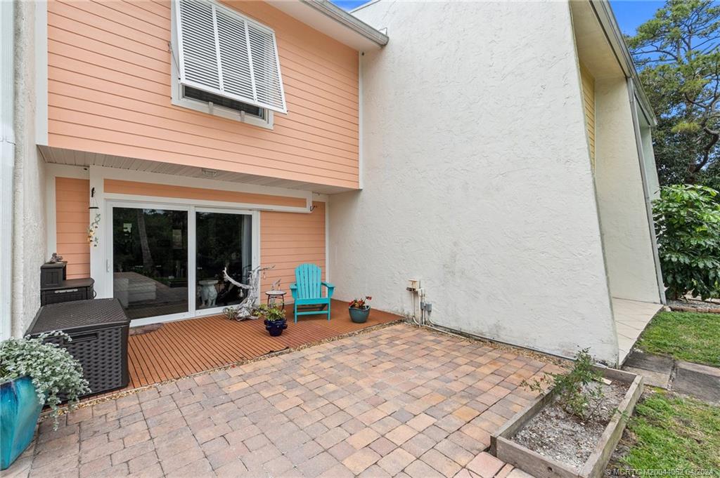 3135 Southeast Indian Street, Unit 5 Stuart, FL 34997 - Photo 30 of 41 a front view of a house with a sitting area