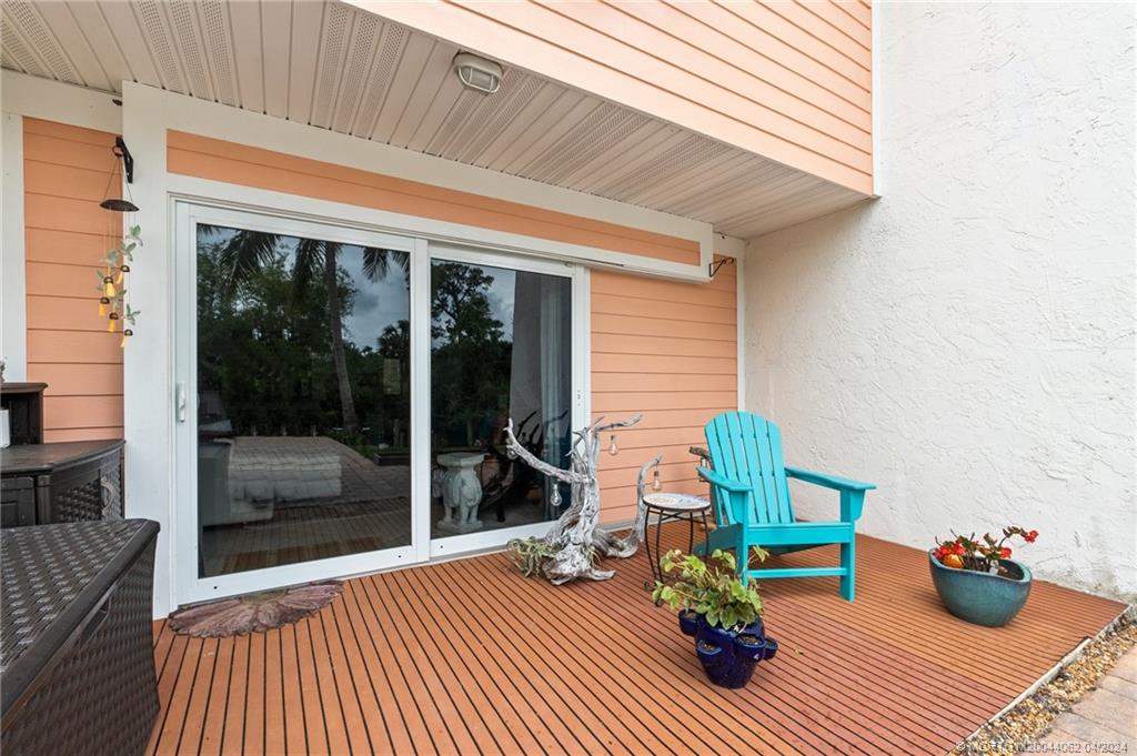 3135 Southeast Indian Street, Unit 5 Stuart, FL 34997 - Photo 31 of 41 a view of a two chairs in the patio