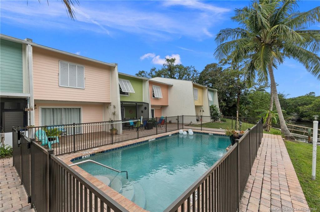 3135 Southeast Indian Street, Unit 5 Stuart, FL 34997 - Photo 34 of 41 a view of a house with pool and ocean view