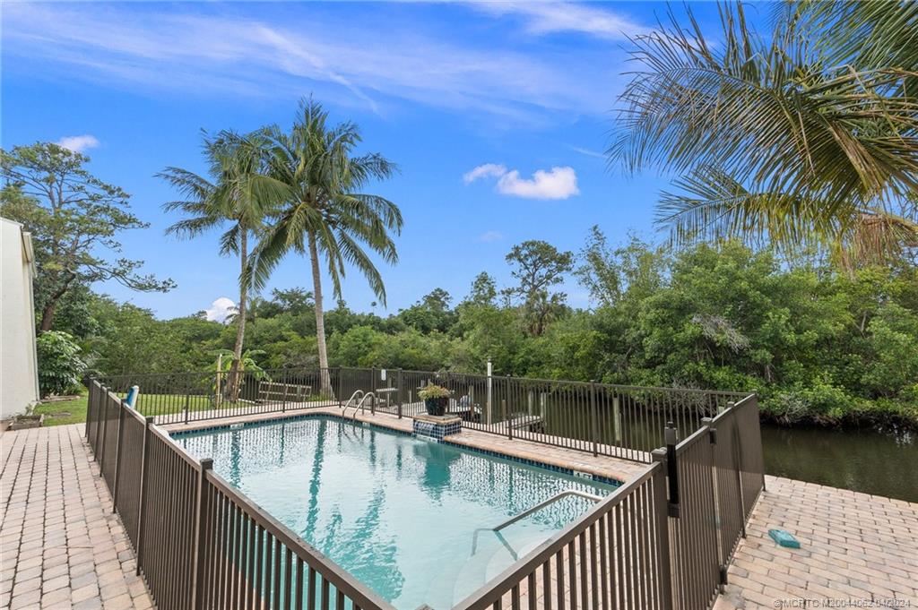 3135 Southeast Indian Street, Unit 5 Stuart, FL 34997 - Photo 35 of 41 a balcony view with a garden