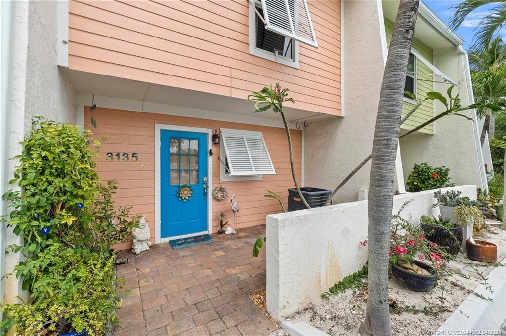 3135 Southeast Indian Street, Unit 5 Stuart, FL 34997 - Photo 5 of 41 a view of a house with patio