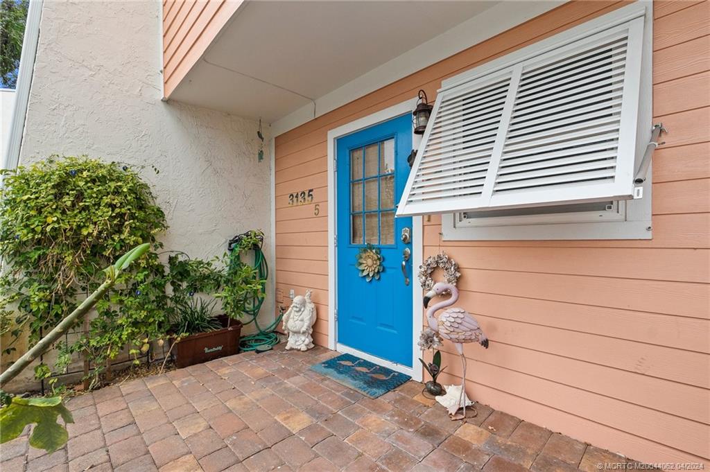 3135 Southeast Indian Street, Unit 5 Stuart, FL 34997 - Photo 6 of 41 a view of front door of house
