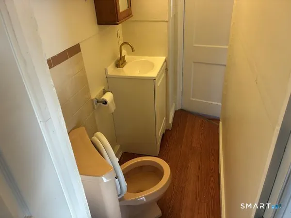 a kitchen with a stove sink and cabinets