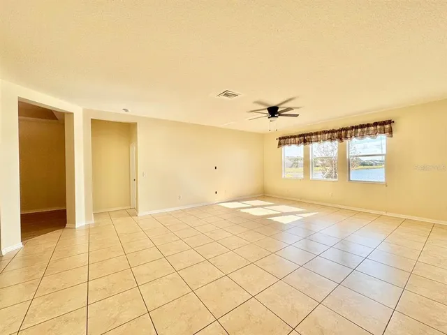 a view of an empty room and window