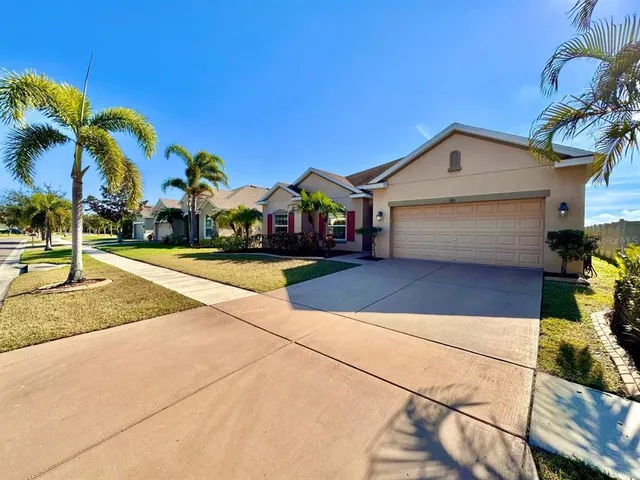 a view of multiple houses with a street