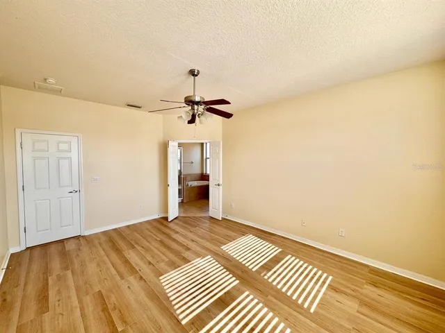 a view of a room with a wooden floor