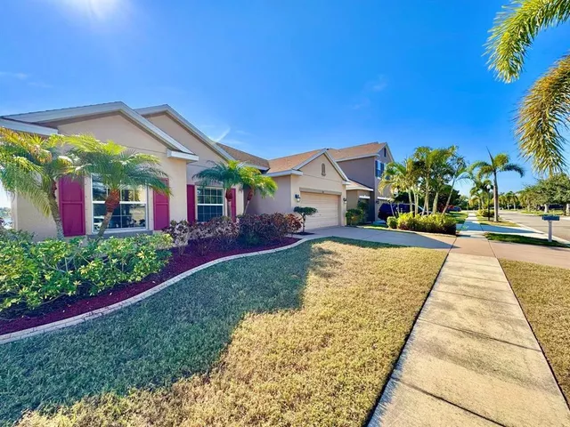 a view of house with outdoor space and garden