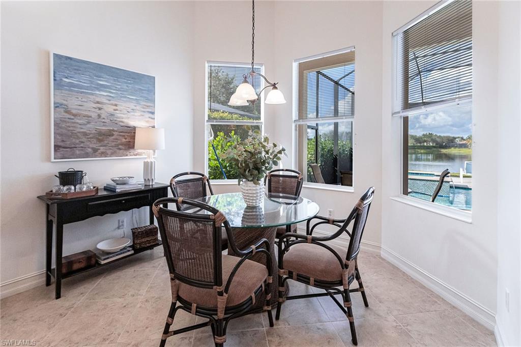 7863 Valencia Court Naples, FL 34113 - Photo 18 of 50 a view of a dining room with furniture window and outside view