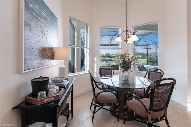 a dining room with furniture and window