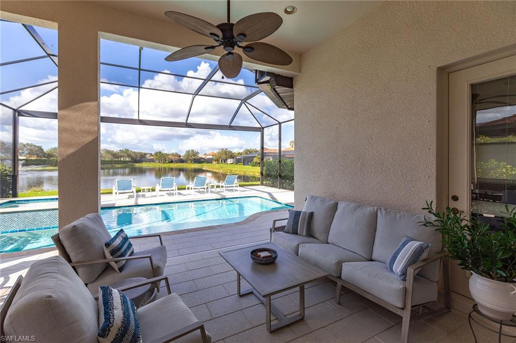 7863 Valencia Court Naples, FL 34113 - Photo 39 of 50 a living room with furniture and a large window