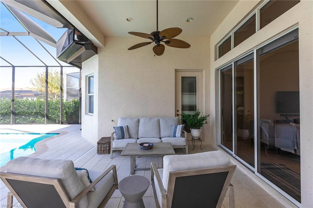 7863 Valencia Court Naples, FL 34113 - Photo 40 of 50 a living room with furniture and a large window