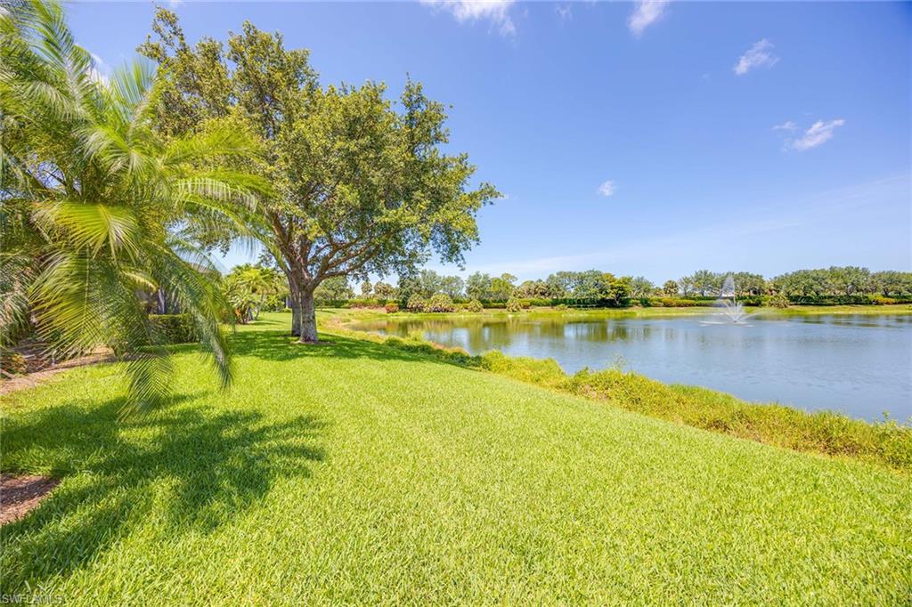 7863 Valencia Court Naples, FL 34113 - Photo 50 of 50 a view of a lake with houses in the background