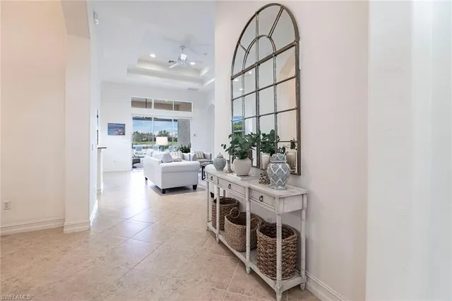 a view of living room filled with furniture and white walls