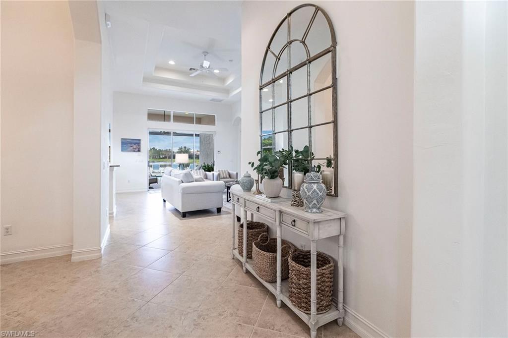 7863 Valencia Court Naples, FL 34113 - Photo 5 of 50 a view of living room filled with furniture and white walls