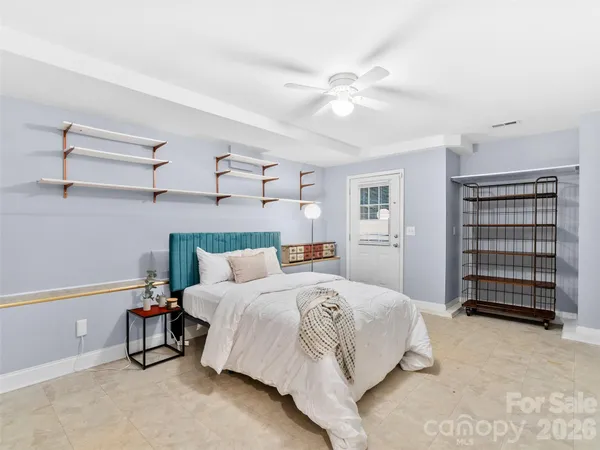 a bedroom with a bed and furniture