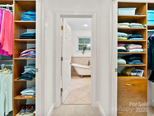 a white bath tub sitting next to a window
