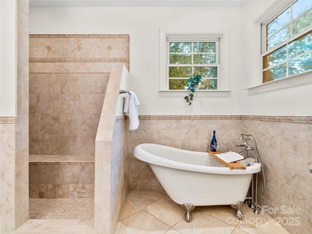 a bathroom with a granite countertop sink a toilet and a mirror