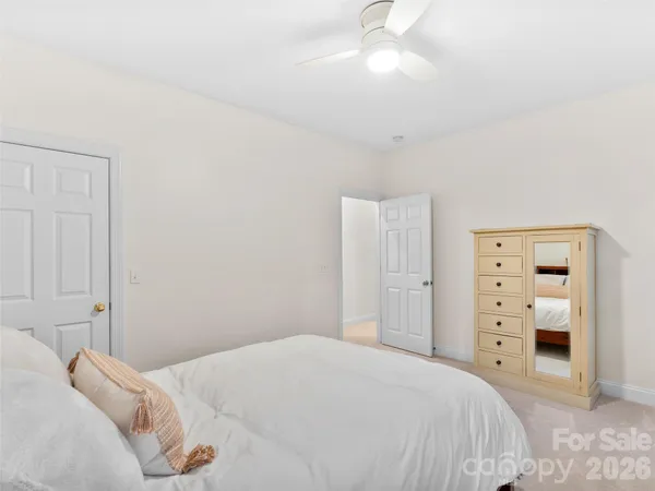 a bedroom with a bed and a closet